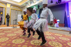 Night to Shine attendees perform a traditional Masese dance.